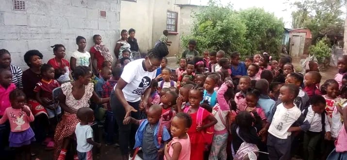 Teacher with children reading bible